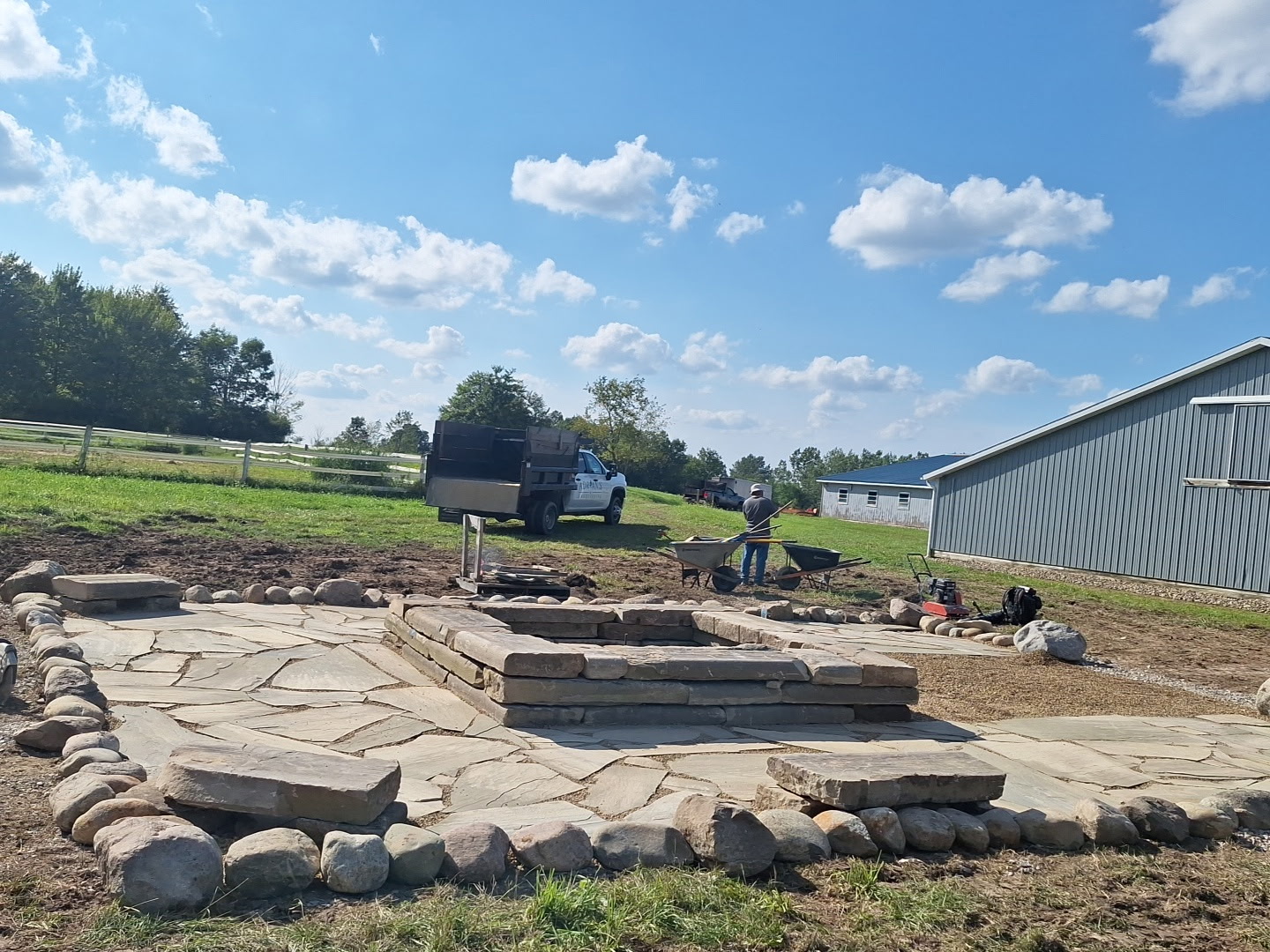 Adrian’s natural stone patio and fire pit during construction